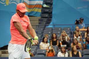 Rafael Nadal hits a tennis ball at Arthur Ashe Kids Day